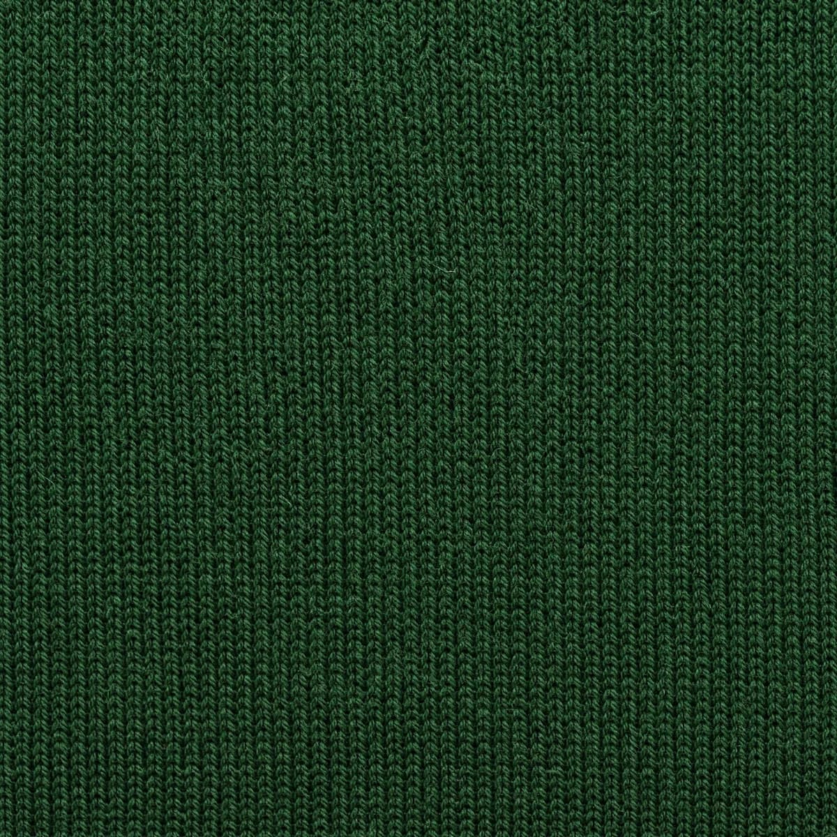 Extreme close-up of a very fine dense knit with tiny tightly packed stitches.