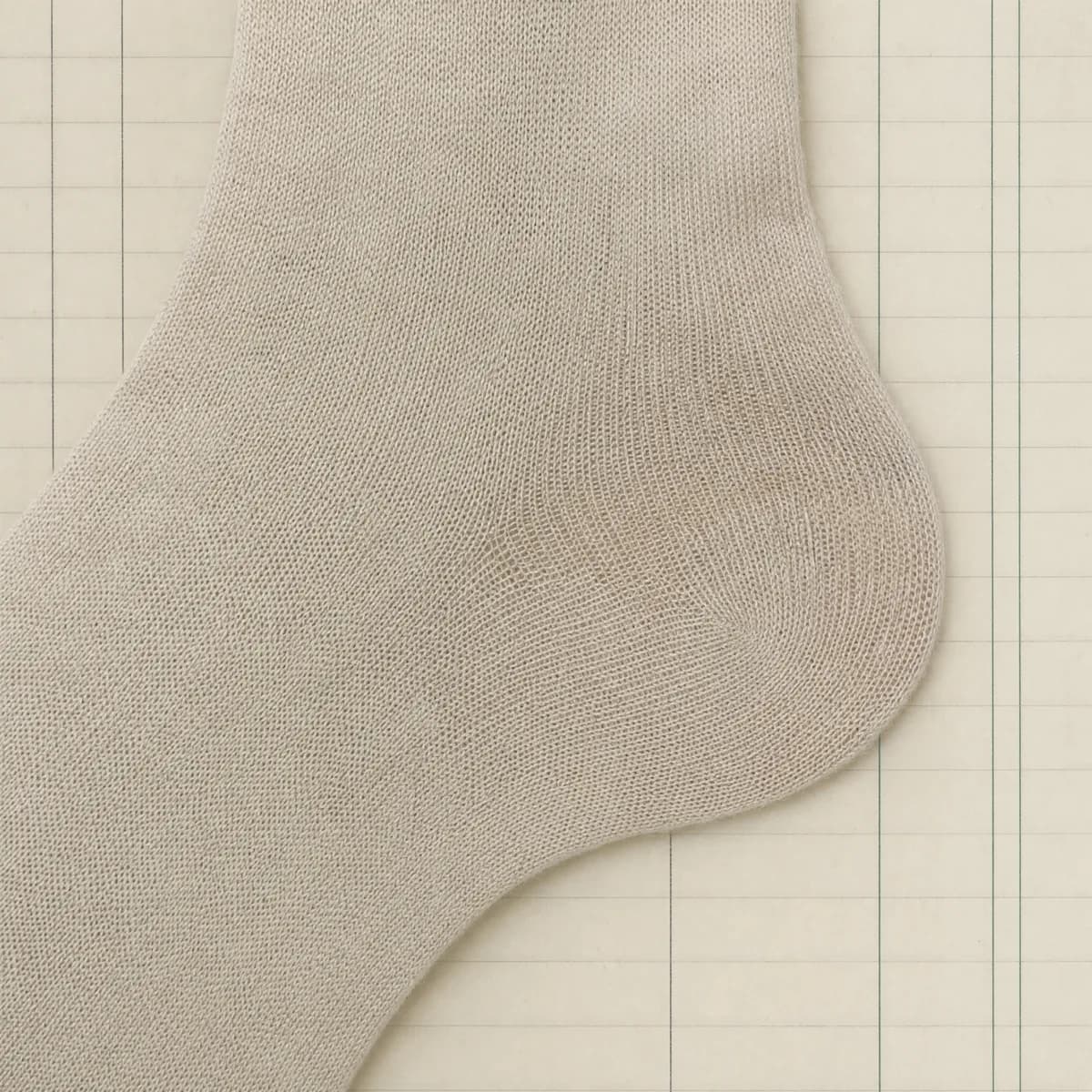 Close-up of a plain sock heel with completely uniform knit and no reinforcement panel.